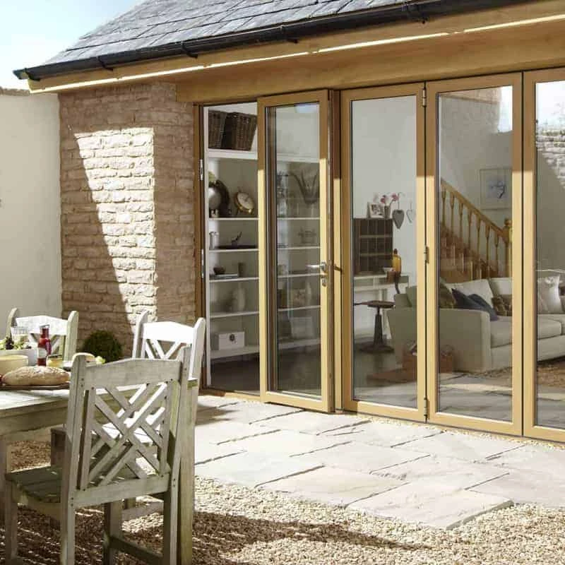 A patio area with a dining table and chairs.